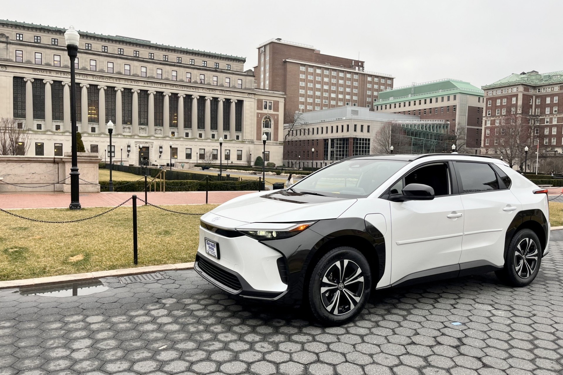A new electric SUV that was purchased for the Public Safety fleet is parked on College Walk, with Butler Library in the background.