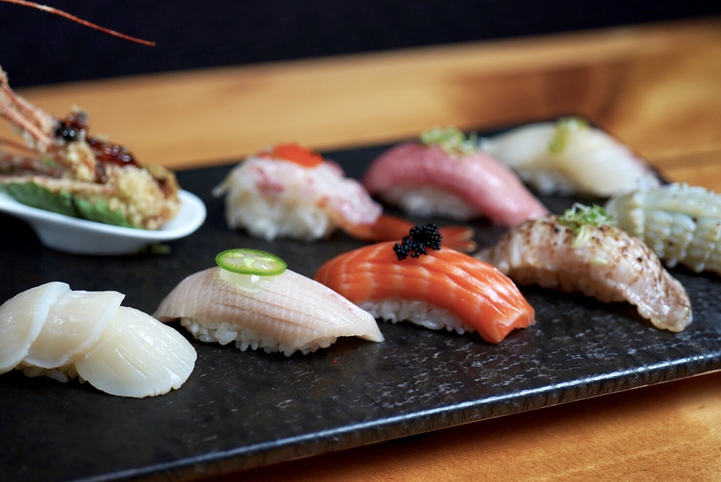 A plate of different types of sushi.