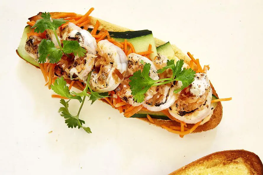 An overview shot of a coconut shrimp Bahn Mi sandwich.