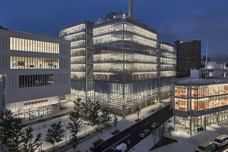 A view of the Manhattanville campus during the evening, with The Forum, Lenfest Center for the Arts, and Jerome L. Greene Science Center in view.